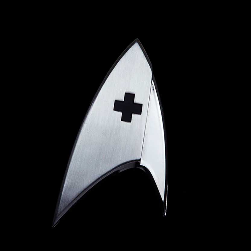 http://www.masterreplicas.com/cdn/shop/files/QMX-Star-Trek-Badge-Discovery-Medical-Magnetic-1.jpg?v=1691498830